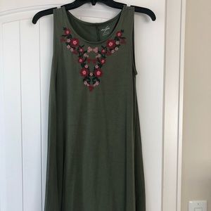 Green tank top dress with floral design.
